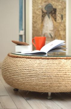 a coffee table with books and a cup on it