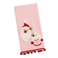 a pink towel with santa claus and sheep on it