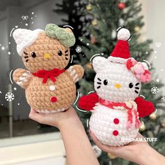 two crocheted hello kitty and teddy bear dolls in front of a christmas tree