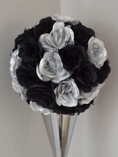 black and white flowers in a silver vase