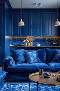 a living room filled with furniture and blue walls