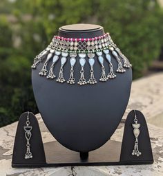 "Add charm and charisma to your beautiful personality with these stunningly handcrafted Afghani chokers in intricate mirror work. The vibrant colours give this choker a very eye catching look. Wear it with any of your formal or casual outfits and grab compliments all the way! Length of the metal part in the choker is 10\" Weight of the choker is 130 gm Note: All in stock items will be shipped from New Delhi, India within 2-3 business days after receipt of payment. International orders may take a Beautiful Personality, Oxidised Silver Jewelry, Choker Handmade, Afghan Jewelry, Candy Necklaces, New Delhi India, Indian Jewellery Design Earrings, Indian Jewellery Design, Bridal Bangles