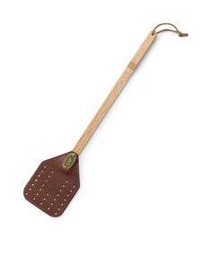 a wooden spatula with metal handles and holes on the handle is shown in front of a white background