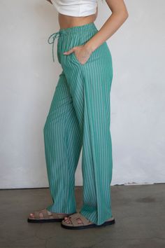 Striped boxer pants. - Sizing: Model is 5'8", wearing a size S - Content: 60% Cotton, 40% Rayon Care: Handwash recommended Imported Green Bottoms With Elastic Waistband For Work, Green Elastic Waistband Bottoms For Workwear, Striped Straight Leg Bottoms With Elastic Waistband, Green Wide-leg Loungewear Pants, Green Wide Leg Bottoms With Elastic Waistband, Green Wide-leg Bottoms With Elastic Waistband, Green Straight Leg Bottoms For Loungewear, Striped Stretch Wide Leg Bottoms, Green Straight Leg Loungewear Bottoms