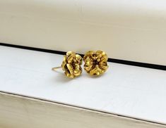 A Vintage 14k Gold Detailed Flower Stud Earrings All items are XRay and Acid tested to ensure metal authenticity. All pieces in this store are solid gold in the purity listed unless otherwise stated.  Weight: 2.6 grams Size: 16.5mm x 11.5mm approximately 14k Yellow Gold Flower Earrings For Anniversary, Gold Flower Charm Earrings In 14k Gold, Tarnish Resistant Gold Flower Earrings For Anniversary, Gold Tarnish-resistant Flower Earrings For Anniversary, Formal Gold Flower Cluster Earrings, Gold Fine Jewelry Flower Earrings For Anniversary, Anniversary Yellow Gold Earrings With Flower Charm, Gold Flower Earrings For Anniversary, Yellow Gold Flower Earrings In Brass