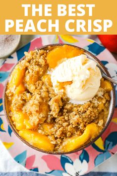 the best peach crisp in a bowl with vanilla ice cream on top and text overlay