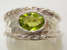 This beautiful ring is part of my new stunning range of contemporary/modern lines and would make a wonderful gift for a loved one or perhaps as a treat for yourself!It will look lovely for any occasion including weddings, engagements, bar/bat mitzvahs, anniversaries, Christenings, Thanksgiving, Christmas, Confirmation, Hannukah, Graduations, Birthdays, Mothers Day. Like all my jewelry pieces, this ring is made in my own workshop. ABOUT THIS RING: The Peridot is a Genuine 8 x 6mm oval solitaire a Modern Peridot Rings For Anniversary, Wide Band Ring, Rope Twist, Peridot Ring, Wide Band Rings, Beautiful Ring, Wide Bands, Thanksgiving Christmas, Pink Tourmaline