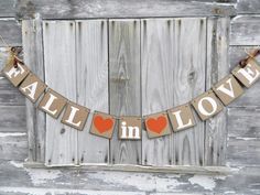 a wooden sign that says fall in love