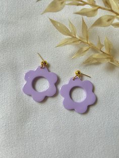 Daisy polymer clay earrings with a glossy finish. Lightweight and durable when handled with care! Hand Painted Purple Resin Earrings, Plastic Earrings For Gifts, Round Plastic Earrings For Gifts, Trendy Purple Flower Earrings For Gift, Flower Shaped Plastic Jewelry As Gift, Purple Plastic Jewelry As Gift, Plastic Flower-shaped Jewelry For Gifts, Flower-shaped Plastic Jewelry As Gift, Plastic Flower-shaped Jewelry As A Gift