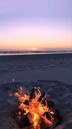 there is a fire pit on the beach