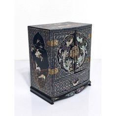 Splendid antique Chinese black lacquer jewelry box with exquisite workmanship. Intricate mother of pearl inlay with brilliant iridescent qualities throughout. The front face is a scene depicting opposing dragons battling over the flaming pearl in the heavens/clouds. The top and sides with scenes of a pair of deers in a beautiful landscape with birds flying overhead with further flowers & fruits.  All highly symbolic and fortuitous. Very unusual bat-form drawer pulls.  The starburst style geometr Antique Jewelry Box, Double Dragon, Mother Of Pearl Inlay, Pearl Inlay, Front Face, Dragon Jewelry, Black Lacquer, Asian Antiques, Birds Flying