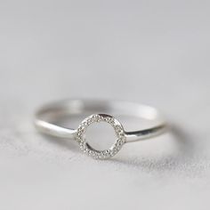 The Diamond Dusted Karma Ring is an understated reminder that you get what you give.A union of simplicity and meaning, the circle on the ring features our signature diamond dusted texture.details+ ring band measures approximately 1.5 mm wide+ available ring sizes 4 - 10.5 (half & whole sizes)+ handmade with love in our Georgia studioavailability handmade to order. ships in 5 - 14 days.          pressed for time? select the rush your order option to have your item made in 1 - 2 business daysd Silver Minimalist Diamond Ring, Minimalist Silver Diamond Ring, Minimalist Silver Diamond Ring For Everyday, Minimalist Everyday Silver Diamond Ring, Everyday Minimalist Silver Diamond Ring, Minimalist Sterling Silver Everyday Diamond Ring, Everyday Minimalist Sterling Silver Diamond Ring, Minimalist Stackable Open Rings With Halo, Minimalist Everyday Stackable Rings With Halo