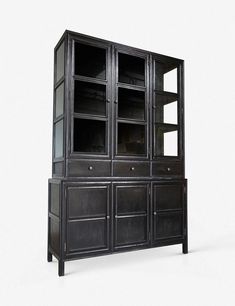 a black bookcase with glass doors and drawers