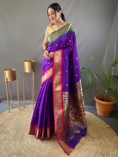 This festival season, elevate your style with our memorable purple zari weaving paithani silk wedding wear saree. Crafted from high-quality silk material, this exquisite saree is designed to make you stand out in any event. The saree features a mesmerizing purple color that exudes elegance and sophistication.
The intricate zari weaving work on the saree adds a touch of opulence and enhances its overall appeal. The elegant rich pallu is adorned with golden motifs that give a regal feel to the sar Diwali Wear, Saree Paithani, Paithani Silk Saree, Wedding Wear Saree, Paithani Saree, Purple Saree, Wear Saree, Blouse Material, Traditional Sarees