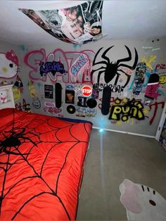 a bedroom decorated for halloween with lots of stickers on the walls