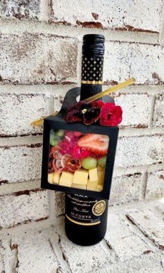 a wine bottle with some fruit on it