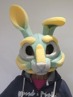 a person wearing a bunny mask and hoodie