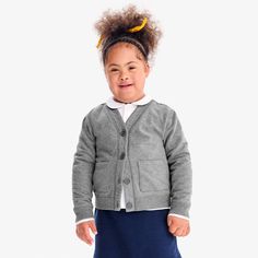 It’s a sweatshirt. It’s a cardigan. It’s a sweatshirt cardigan! Polished enough to wear to school, while feeling like their favorite worn-in sweatshirt. A+! Fabric: French terry, 95% cotton / 5% spandex. Pre-washed to minimize shrinkage. Feel: Soft and comfortable with breathable warmth and a hint of stretch. Learn more. Fit: Relaxed; front buttons and pockets for lunch money. Casual Sweatshirt With Ribbed Cuffs For Play, Casual Winter Sweatshirt For Playwear, Long Sleeve Fall Sweatshirt For School, Casual Long Sleeve Outerwear For Play, Winter Cotton Cardigan For School, Long Sleeve Sweatshirt For Playwear In Fall, Casual Cotton Sweater For School, Casual Cotton School Sweater, Casual Fall Sweater For Playwear