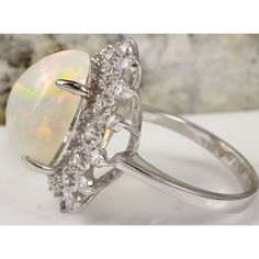 6.73 Carats Natural Impressive Ethiopian Opal and Diamond 14K Solid White Gold Ring Suggested Replacement Value: $6,800.00 Total Natural Opal Weight is: Approx. 5.73 Carats Opal Measures: Approx. 15.38 x 12.07mm The head of the ring measures: Approx. 21.14 x 20.63mm Total Natural Round Diamonds Weight: Approx. 1.00 Carat (color G-H / Clarity SI1-SI2) Ring total weight: Approx. 5.9 grams Disclaimer: all weights, measurements and colors are approximate and may vary slightly from the listed dimensi Etsy Gold Ring, White Gold Ring, Natural Opal, Quality Diamonds, White Gold Rings, Ethiopian Opal, Estate Jewelry, Jewellery And Watches, Gold Ring