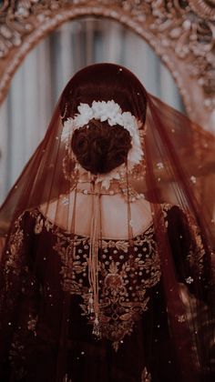 the back of a woman's head wearing a veil