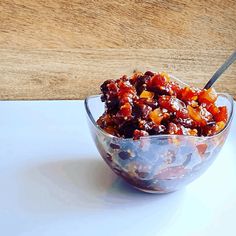 a bowl filled with food sitting on top of a white plate