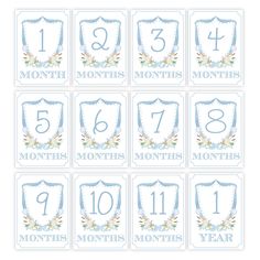 blue and white baby's first birthday calendar with flowers on it, including the number one