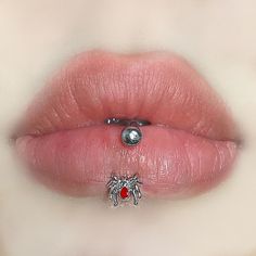 a woman's lips with a nose ring on it