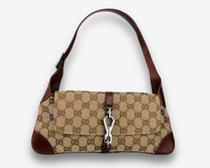 Brand - Gucci Model - Jackie O Flap Era - 2000s Origin - Made in Italy Measurements - 29,5*15*1,5cm Exterior Material - canvas & leather Interior Material - textile Color - beige & brown Color of the hardware - grey Details - Inside pocket × 1 Serial code - 90667 000926 Condition - very good, no defects Please note that vintage items are not new, but have a history that makes them so special. That is why some of them may show signs of wear. We always indicate the condition of the items in the de Formal Monogram Canvas Shoulder Bag With Logo Hardware, Brown Monogram Canvas Shoulder Bag With Logo Hardware, Rectangular Canvas Shoulder Bag With Logo Hardware, Casual Rectangular Shoulder Bag With Logo Hardware, Retro Monogram Canvas Shoulder Bag For Everyday, Retro Monogram Canvas Rectangular Shoulder Bag, Retro Rectangular Monogram Canvas Shoulder Bag, Beige Brown Color, Gucci Model