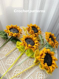 three sunflowers are sitting on top of a lace doily with the words crochet patterns above them