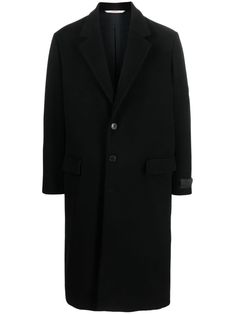 Valentino Ready To Wear black wool blend notched lapels front button fastening shoulder pads long sleeves buttoned cuffs two front flap pockets central rear vent below-knee length straight hem The full look includes Valentino Garavani accessories. Luxury Black Wool Coat With Button Closure, Black Designer Wool Coat With Button Closure, Black Wool Blazer With Concealed Fastening, Designer Black Long Wool Coat, Designer Winter Blazer With Concealed Fastening, Black Wool Coat With Lapel Collar, Black Wool Coat With Concealed Placket And Lapel Collar, Winter Designer Blazer With Concealed Fastening, Designer Wool Coat With Double Button For Business