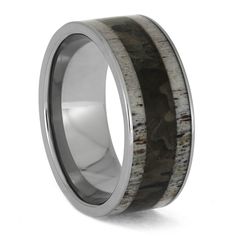 the men's wedding band with antler wood inlays is made from stainless steel