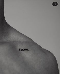 a man's chest with the word now written on it