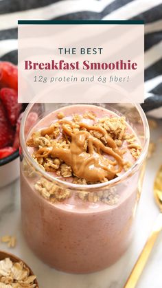 the best breakfast smoothie in a glass with strawberries and granola on top