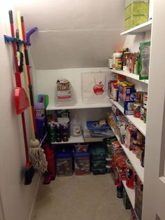 the pantry is stocked with all kinds of food and cleaning supplies, including brooms