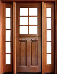 an open wooden door with two sidelights