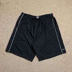 Nike Swim Shorts Poolside Vintage Y2K 00s Summer Holiday Surf Black & Grey XL.  Colour: Black & Grey  Has some minor iron marks (see photo) which does not take away from the beauty of this piece!  Size: XL  Measurements: Waist measures approx 33 inches WHEN RELAXED (the waist is elasticated so it will expand & fit a larger waist size that this measurement) Length (top to bottom): 21 inches Leg opening (flat across/width): 14 inches   Message for quote on International Delivery.   Check out our o Nike Swim Shorts, Nike Swim, Mens Swim Trunks, Measurement Length, Summer Holiday, Swim Trunks, Swim Shorts, Black Grey, Vintage Y2k