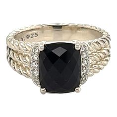 This is an authentic ring by David Yurman from his Wheaton Petite Collection. Crafted from sterling silver featuring an oval faceted cut black onyx gemstone with 5 small round cut diamonds on each side of the gemstone. The ring is a triple cable style from the shoulders to the back and tapers off to a polished solid band. It is signed by the designer with the silver content.    Brand:  David Yurman  Hallmark:  D.Y 925  Gemstone: black onyx 10mm long x 8mm wide  Diamond:  8 points    Material: st Black Onyx Ring David Yurman, Luxury Silver Onyx Rings, David Yurman Black Onyx Bracelet, Onyx Oval Cabochon Rings For Gift, Black Sterling Silver Diamond Ring, Fine Jewelry, David Yurman, Round Cut Diamond, Solitaire Ring, Black Onyx