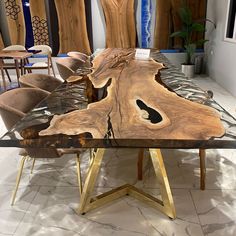 the table is made out of wood and has been designed to look like a tree trunk