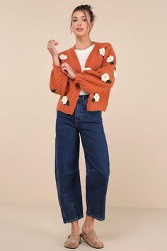 We know that the Lulus Chosen Charm Rust Orange Knit Embroidered Cardigan Sweater will always be your first pick when it comes to showing off your style! Cozy, heavy-gauge knit shapes this eye-catching cardigan sweater that features three-dimensional, crocheted floral embroidery throughout. Long balloon sleeves (with drop shoulders and fitted cuffs) frame a wide-cut, open-front bodice. Ribbed knit accents the neckline, cuffs, and hem. Fit: This garment fits true to size. Length: Size medium meas Trendy Embroidered Knit Sweater, Trendy Embroidered Fall Cardigan, Casual Winter Cardigan With Floral Embroidery, Winter Floral Embroidered Knit Cardigan, Embroidered Knit V-neck Cardigan, Embroidered V-neck Knit Cardigan, Embroidered Knit Cardigan For Fall, Fall Floral Embroidered Cotton Cardigan, Casual Embroidered Knit Outerwear