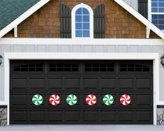 a garage door decorated for christmas with candy canes on the front and side windows