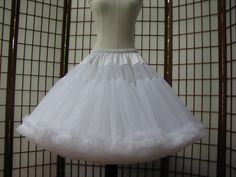 "This listing is for a custom order for a super-full double layer nylon organdy petticoat with satin waist and chiffon bottom ruffles. The pictured petticoat was designed for a 31\" (78,5cm) waist and is 24\" (61cm) long. It is displayed on a dress form with a 22\" (55cm) waist. You can choose any length you need. I will lengthen each of the tiers to achieve extra length. If you would prefer that I add another tier to achieve extra length, then the price will increase substantially. If you would Party Organza Petticoat With Ruffles, Organza Petticoat With Ruffles For Parties, Stretch Tulle Petticoat With Attached Cancan, Elegant Organza Petticoat With Tulle Skirt, Elegant Organza Petticoat For Wedding, Elegant Organza Wedding Petticoat, Elegant Wedding Organza Petticoat, Elegant Tulle Petticoat With Ruffles, Stretch White Petticoat With Attached Cancan