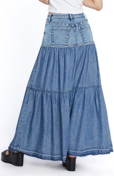 Perfect your casual-cool vibe in this denim maxi skirt designed with flouncy tiered ruffles. 37 1/2" center front length (size 29) Unlined 66% cotton, 22% REPREVE® recycled polyester, 8% polyester, 3% rayon, 1% spandex Machine wash, tumble dry Imported Medium Wash Denim Tiered Skirt, Flowy Denim Tiered Skirt, Summer Denim Tiered Maxi Skirt, Denim Tiered Maxi Skirt For Summer, Flowy Tiered Denim Skirt, Medium Wash Tiered Denim Skirt, Casual Fitted Tiered Maxi Skirt, Denim Maxi, Denim Maxi Skirt