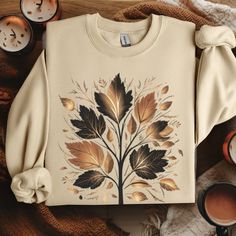 Elegant fall fashion women's sweatshirt with a boho vibe, perfect fall clothing for cool days. Stylish autumn apparel with a golden leaf design. Welcome fall with warmth! Welcome to Trendy Blend Studio! If you're searching for soft, comfy, top-quality t-shirts, sweatshirts, hoodies, and more, you've come to the right place. At Trendy Blend Studio, we are passionate about our craft and dedicated to providing you with a perfect shopping experience. Have questions, concerns, or feedback about our p Bohemian Fall Sweater, Bohemian Cotton Sweater For Fall, Bohemian Relaxed Fit Sweater For Fall, Bohemian Crew Neck Sweatshirt For Fall, Bohemian Relaxed Fit Sweatshirt For Fall, Bohemian Long Sleeve Sweatshirt For Winter, Bohemian Long Sleeve Sweatshirt With Relaxed Fit, Bohemian Long Sleeve Relaxed Fit Sweatshirt, Bohemian Crew Neck Sweatshirt With Relaxed Fit