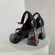 These Dark Romantic Gothic Rose High Heels are expertly crafted for fashion enthusiasts who appreciate dark aesthetics. With a combination of chunky, pump, and mary jane heel styles, these heels offer a unique and captivating design. The striking red and black color palette creates a mysterious and alluring vibe, making them perfect for goth, punk, or grunge looks. Made from vegan leather, these heels feature transparent block heels with real rose accents inside. The adjustable buckle ankle stra Gothic High Heels, Black Mary Jane Shoes, Mary Jane Platform Shoes, Zapatos Mary Jane, Punk Shoes, Gothic Shoes, Cosplay Shoes, Platform Mary Janes, Mary Jane Heels