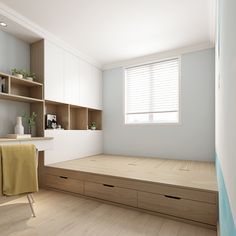 an empty room with wooden flooring and shelves on the wall next to a window