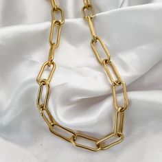 This fashion forward Paperclip Chain is a must have for every jewelry collection. It fits perfectly with any look and pairs with other jewelry for an ultra stylish look. | MATERIALS | - 18K Gold PVD Plated Stainless Steel | DETAILS | - 12mm Links - 20 inches - Waterproof | SHIPPING | All orders are sent via Canada Post. When checking out you may choose Untracked or Tracked Shipping.  Canada - Regular Shipping (NOT Tracked) 3-7 Business Days  - Expedited Shipping (Tracked)  2-6 Business Days Unit Gift Chain Link Necklace Tarnish Resistant, Tarnish Resistant Chain Link Necklace Gift, Tarnish Resistant Chain Necklace Gift, Tarnish-resistant Chain Link Necklace Gift, Paperclip Chain Necklace As A Gift, Trendy Link Chain Necklace Gift, Gift Oval Link Chunky Chain Necklace, Gift Oval Link Chain Necklace With Chunky Chain, Gift Chain Necklace With Chunky Oval Links