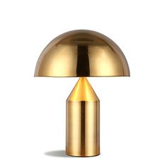 a gold lamp on a white background with the light turned off and it's base lit up