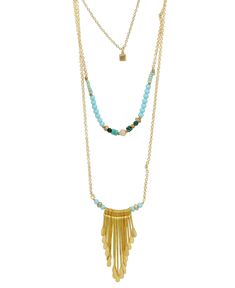 This unique stacked necklace of gold-plated brass brings to mind a sunny day with clear blue skies. Made of three separate chains beaded chains and featuring a fringed pendant that looks just like the sun's rays. Pendant is 2 inches long and about 1.25 inches wide. Longest chain is about 28 inches long, middle chain is about 24 inches long, shortest chain is 19 inches long. Shortest chain is topped with a little geometric cube pendant. Necklace has a 2 inches extender for an adjustable length. H Bohemian Gold Layered Beaded Necklaces, Gold Layered Bohemian Beaded Necklaces, Adjustable Fringe Dangle Necklace, Adjustable Gold Fringe Necklaces, Adjustable Gold Necklace With Fringe, Bohemian Double Strand Gold Beads Necklace, Bohemian Multi-strand Layered Necklace With Double Chain, Bohemian Double Strand Chain Necklace, Gold Multi-strand Necklace With Dangling Beads