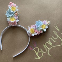 a close up of a headband with flowers on it