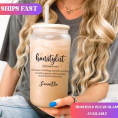 a woman sitting on a couch holding a drink in her hand with the words hairstylist printed on it